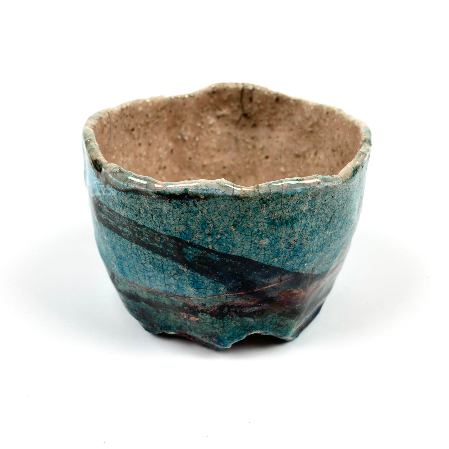 Artistic Raku-fired ceramic bowl by Serhiy Verbicki, featuring a crackled turquoise glaze with earthy brown accents and a speckled beige and pink interior.